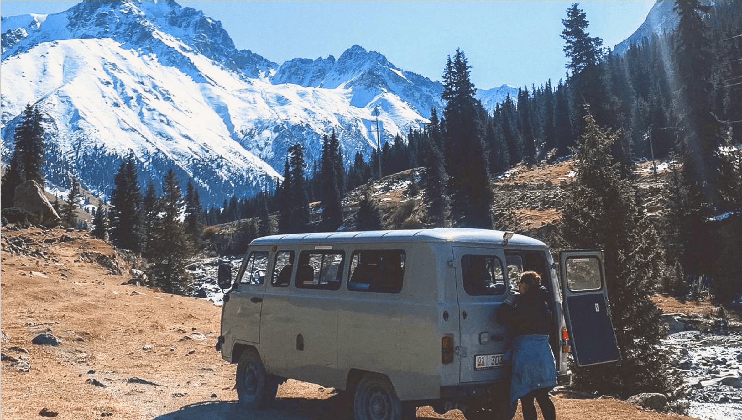 Van with Snowy Peaks